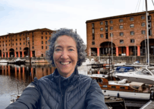 TAKING SKILLS INTO RETIREMENT Picture of adult woman by Albert dock liverpool