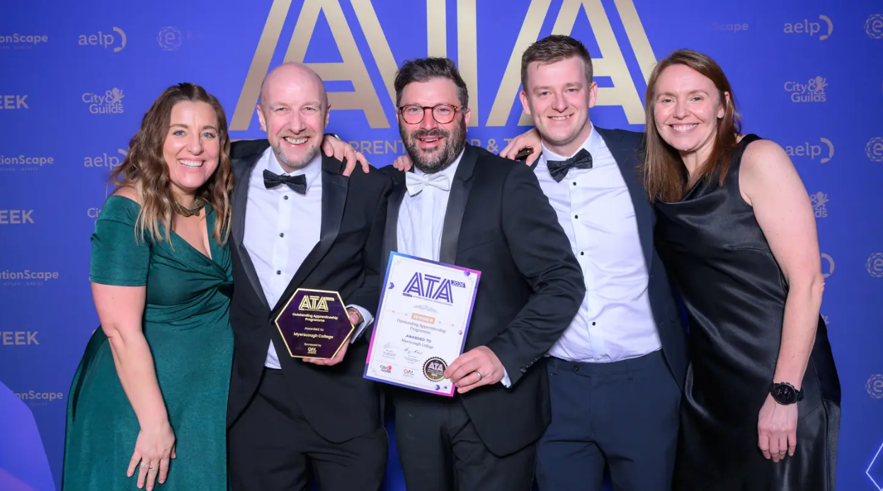 College staff receiving an award at ATA ceremony