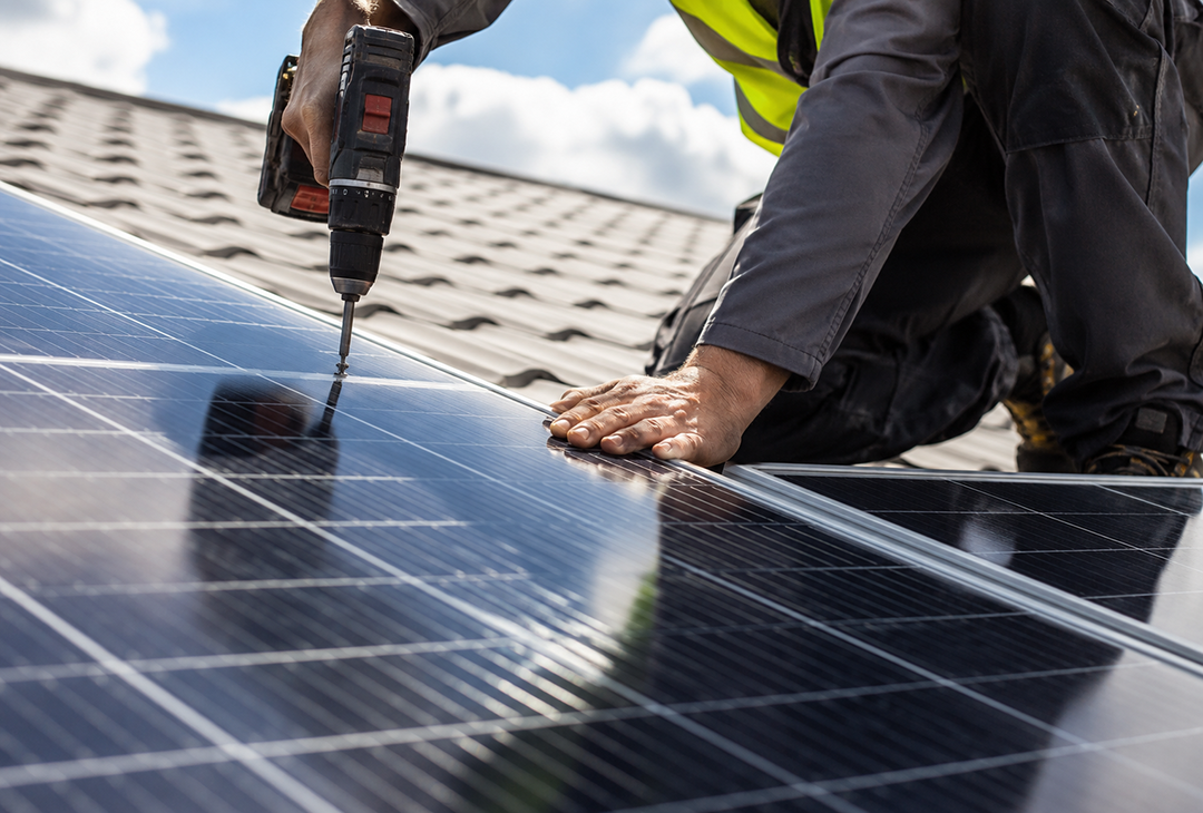 Image of solar panels being installed on rooftop