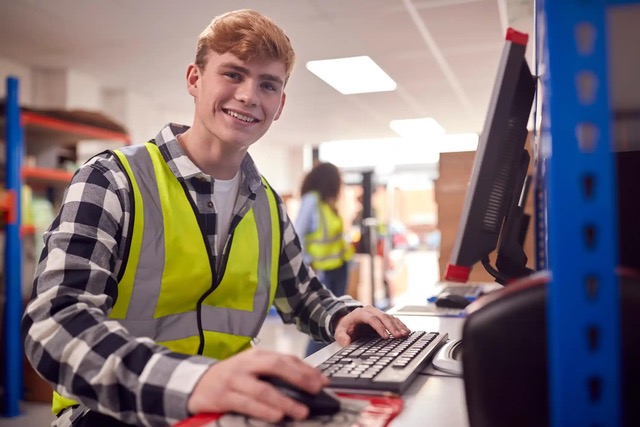 Image of young male wearing a vision vest in working environment