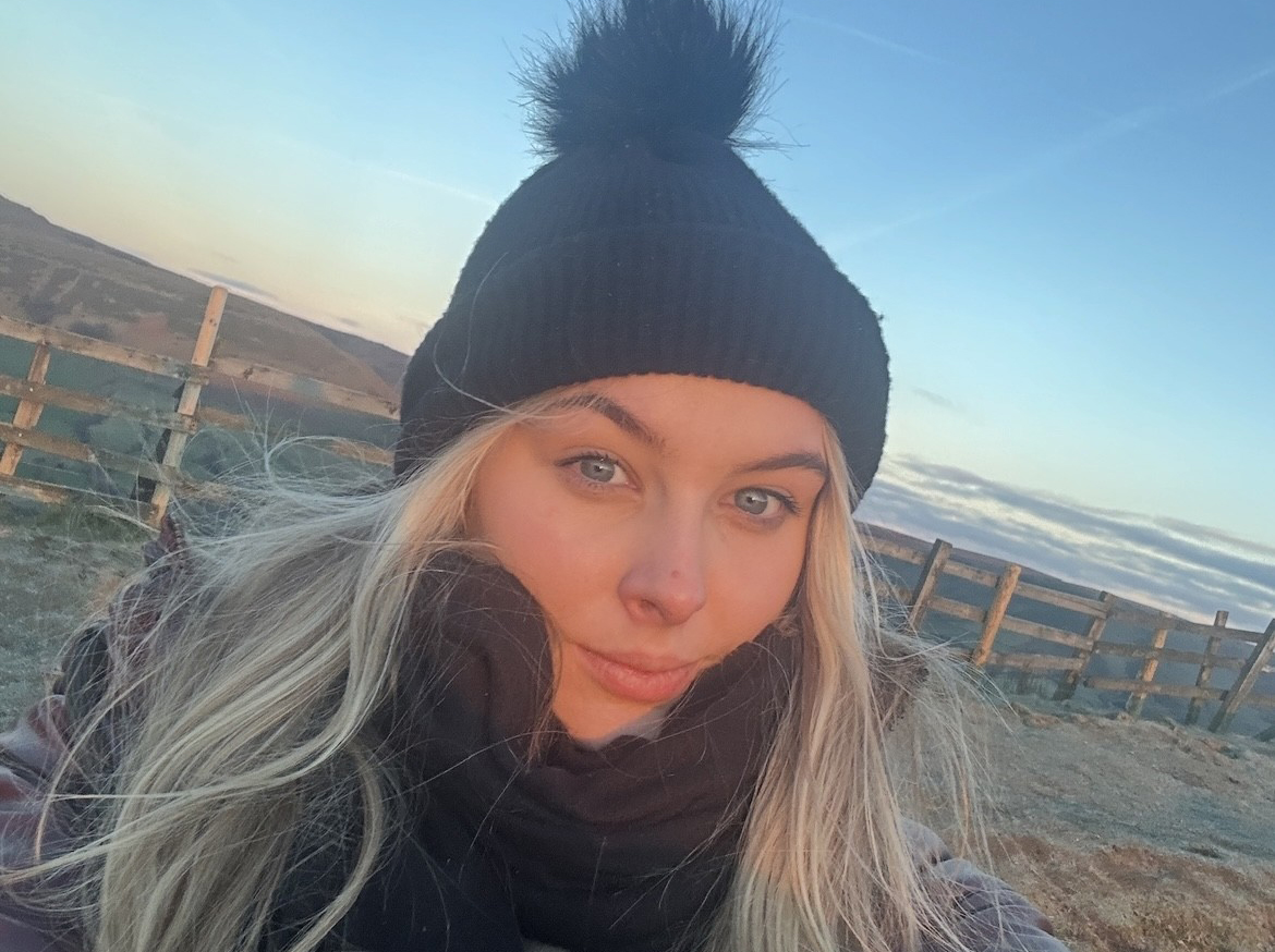 Young female apprentice pictured by coast