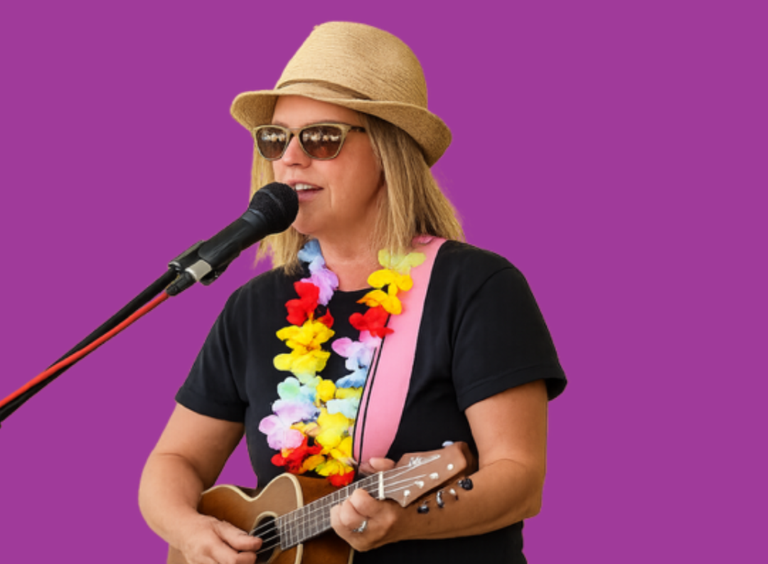 Female musician performing on stage with pink background