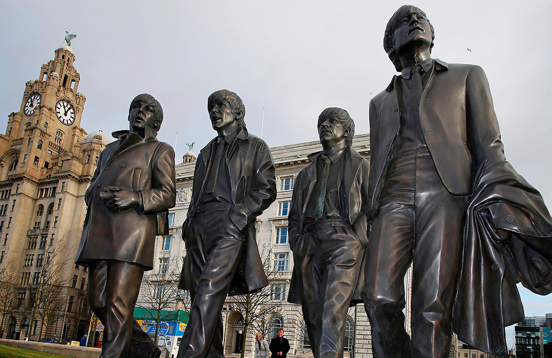 Image of Beatles bronze statues pictured next to Liver Building
