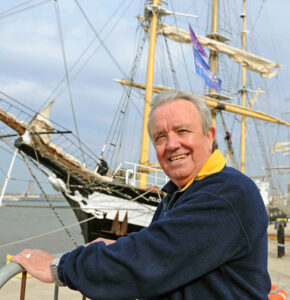 IMAGE OF MALE STOOD BY TALL SHIP IN LIVERPOOL